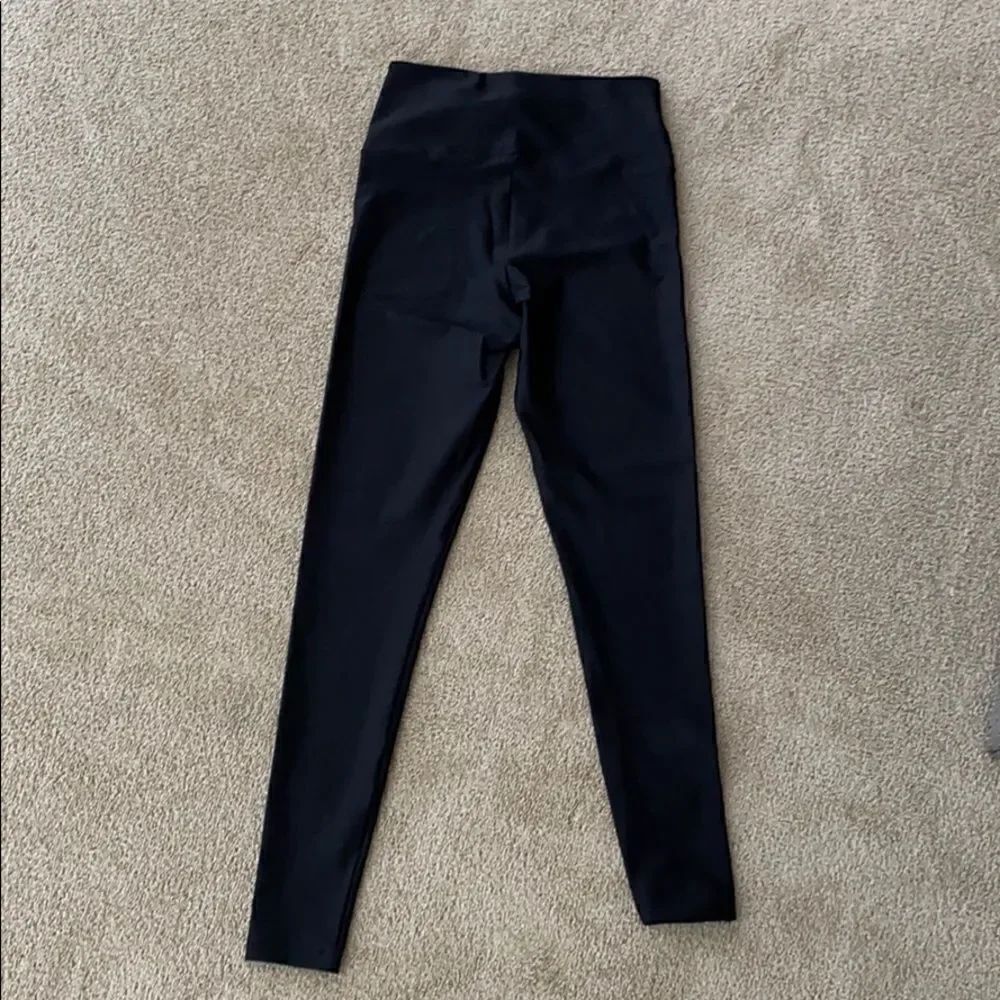 Black size and fit shiny legging.